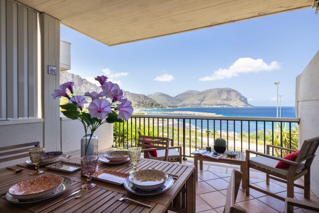 Outdoor dining area on a spacious sea-view balcony in Addaura near Mondello beach